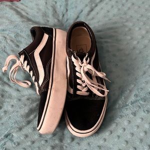 Black and white low top vans